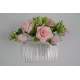 Kam met roze bloemen en groene blaadjes