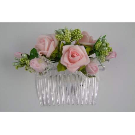 Kam met roze bloemen en groene blaadjes